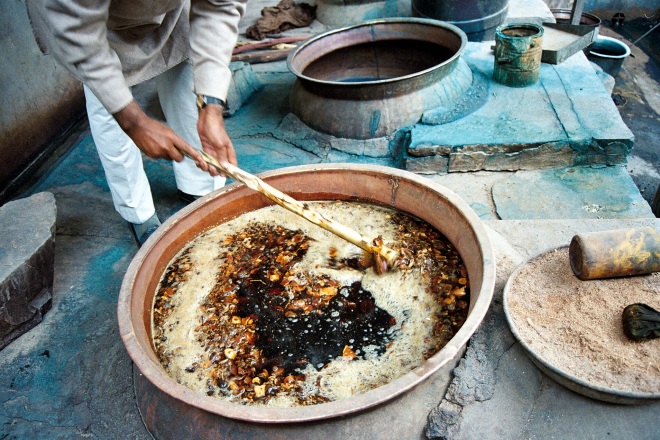 Dye-masters at Mehera Shaw, a fair trade company in India, mix ingredients for natural dyes.
